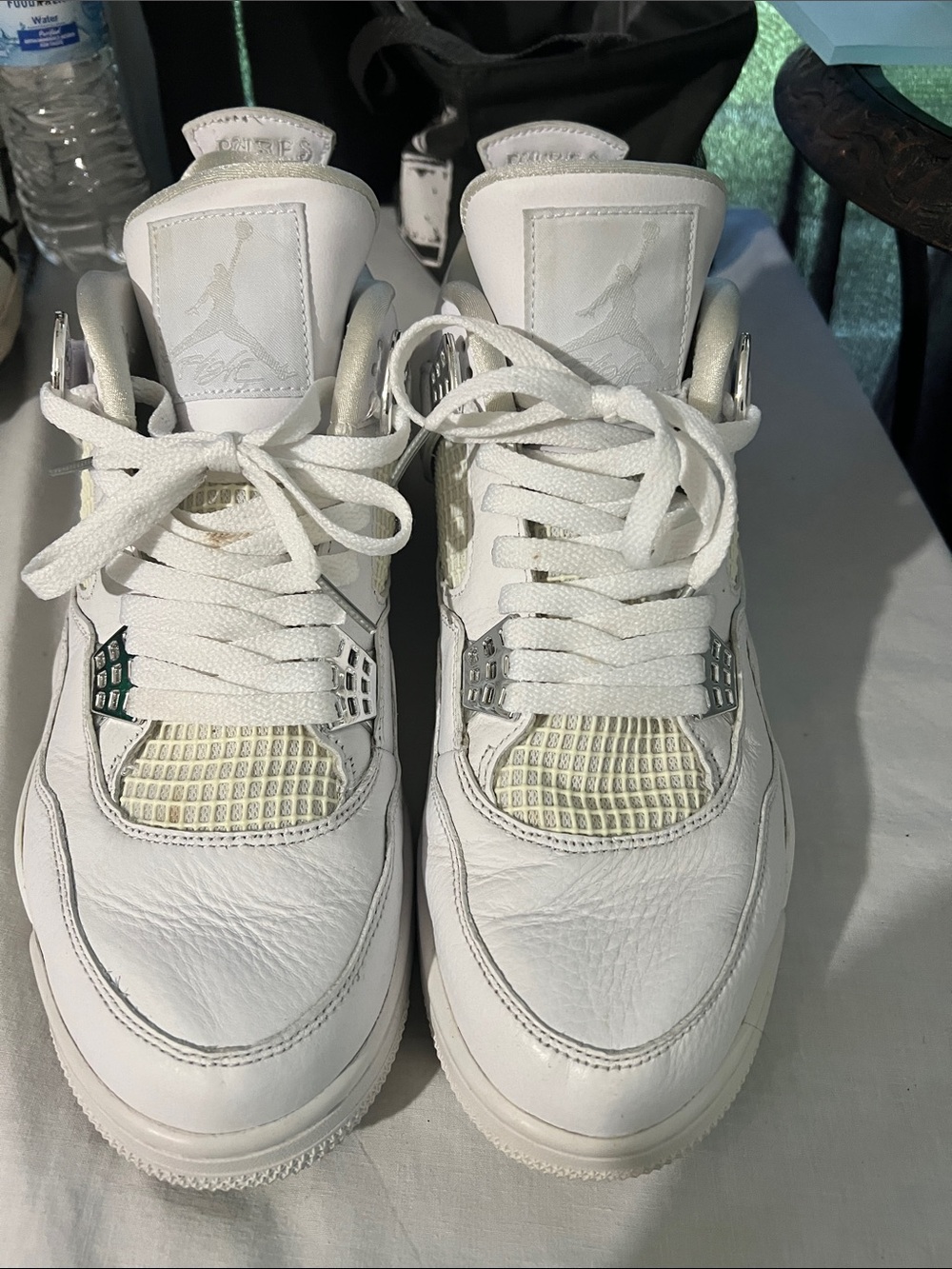 Air Jordan 4 Retro White Leather Sneakers